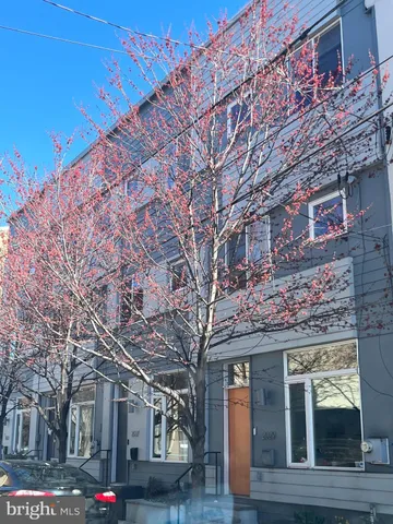 a yellow building in front of it