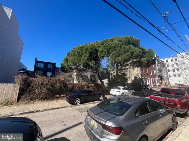a view of a car parked in front of a house