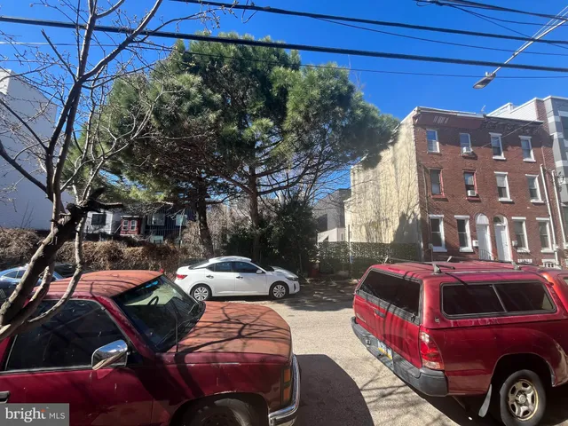 a front view of a house with parking space