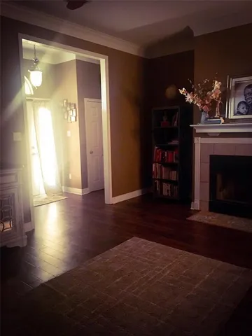a view of a livingroom with furniture window and wooden floor