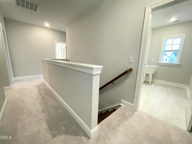 a bedroom with a bed and flat screen tv