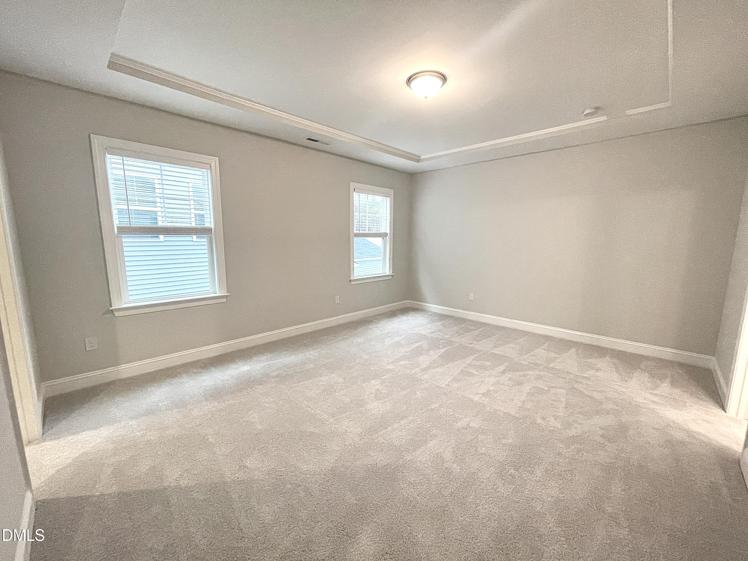 207 Edge Of Auburn Boulevard Raleigh, NC 27610 - Photo 14 of 32 an empty room with windows