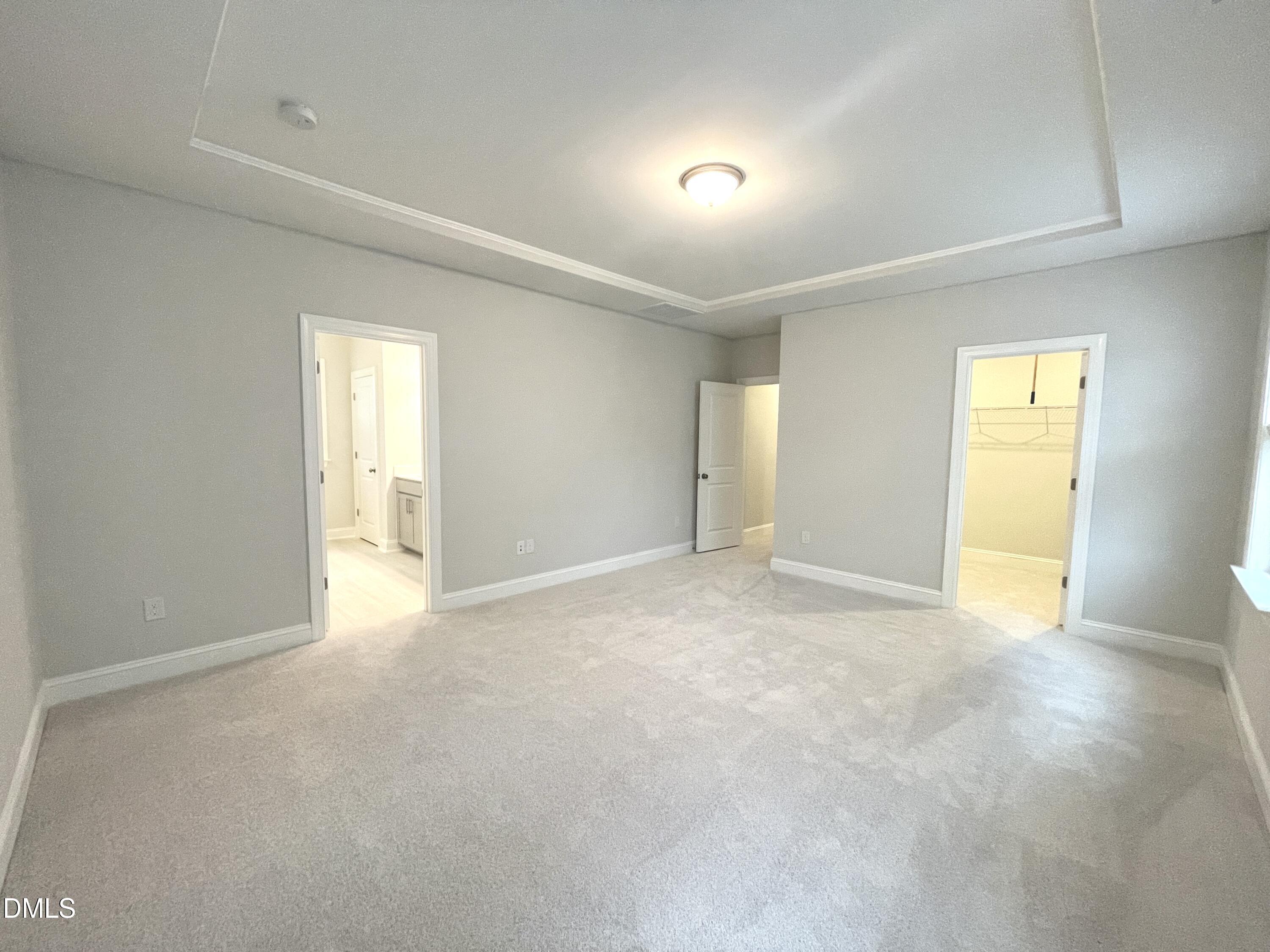 207 Edge Of Auburn Boulevard Raleigh, NC 27610 - Photo 15 of 32 a view of an empty room with a window
