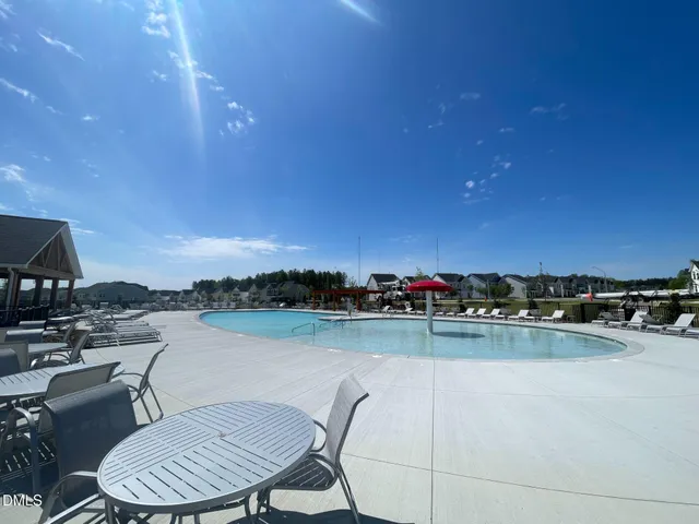 a view of a swimming pool and a chairs