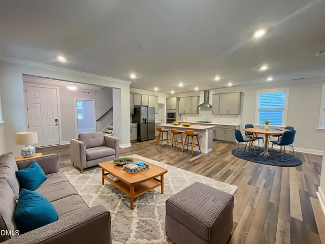 a view of kitchen view wooden floor and kitchen view