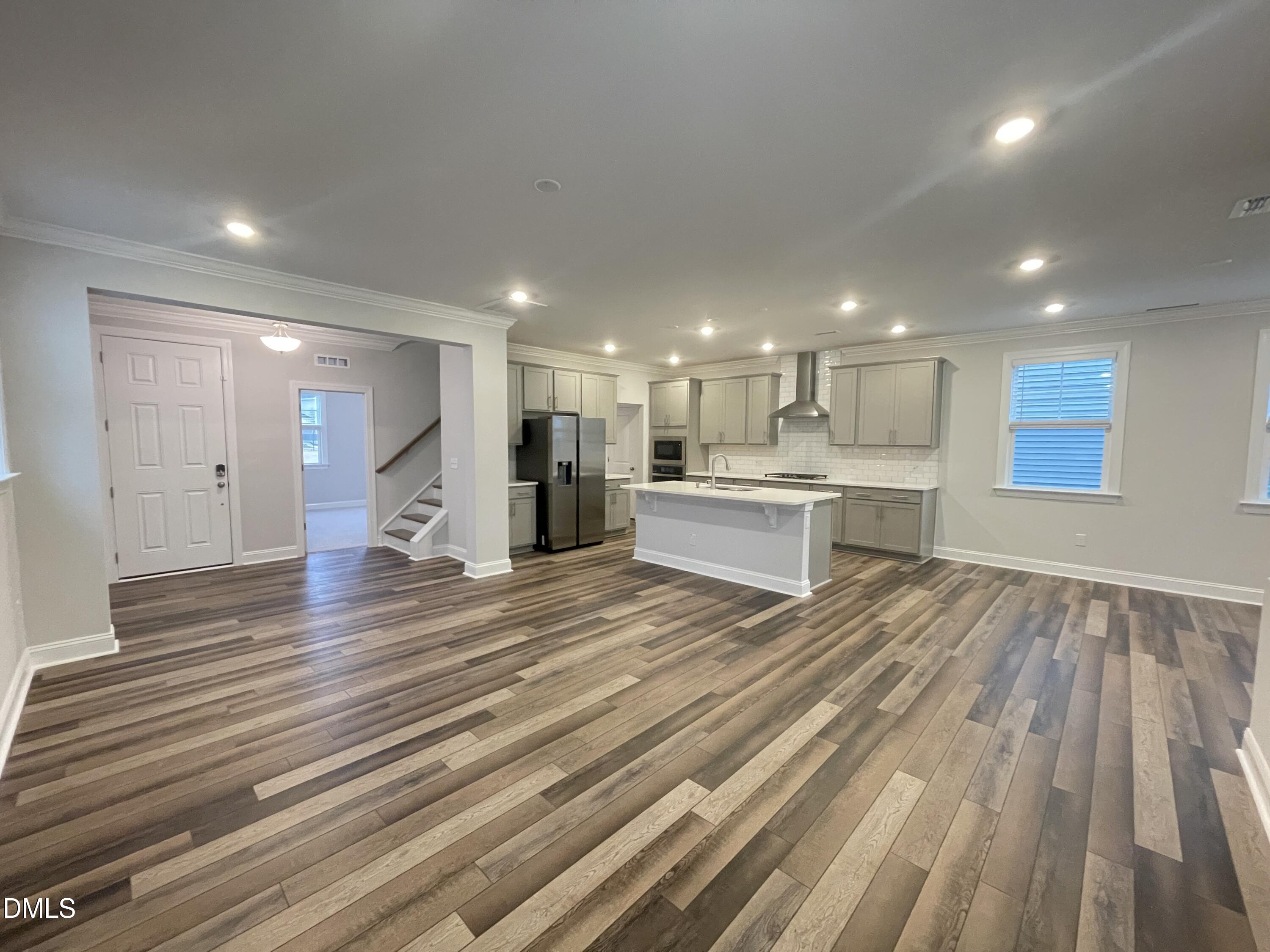 207 Edge Of Auburn Boulevard Raleigh, NC 27610 - Photo 5 of 32 a view of kitchen view wooden floor and kitchen view