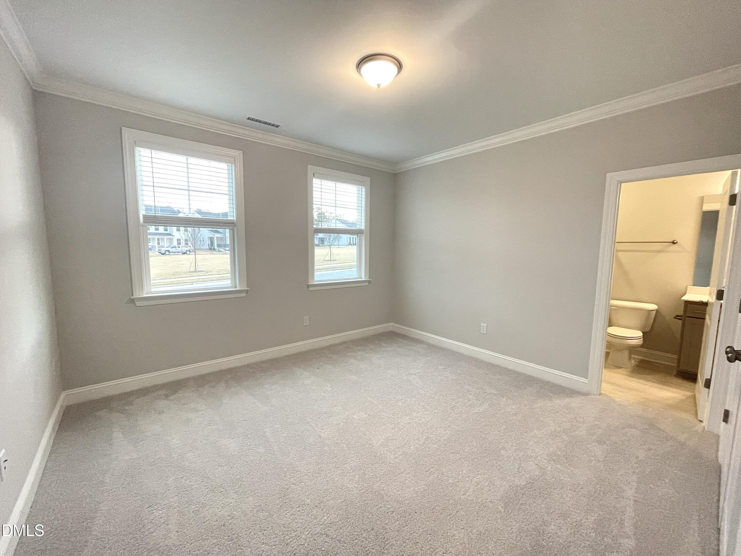 207 Edge Of Auburn Boulevard Raleigh, NC 27610 - Photo 9 of 32 a view of an empty room with a window