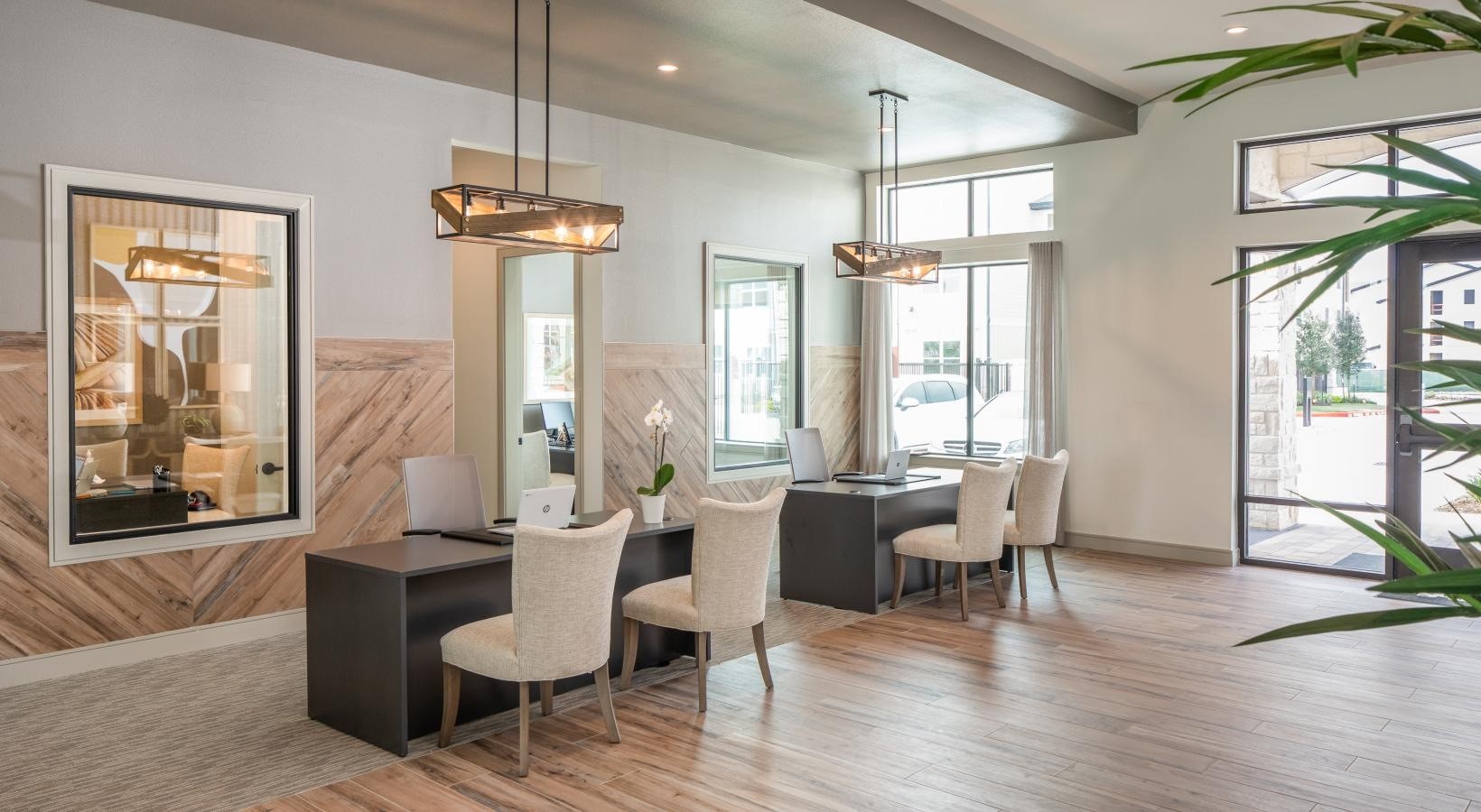 12111 South Main Street, Unit 12305 Houston, TX 77035 - Photo 10 of 24 a dining room with wooden floor a chandelier a glass table and chairs