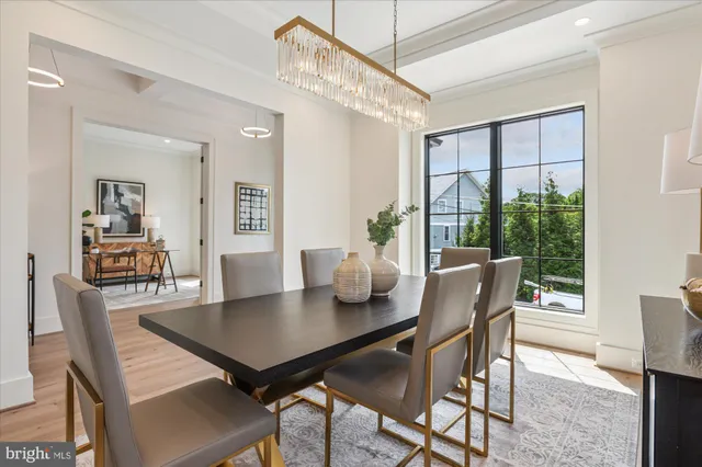 a large kitchen with kitchen island a large counter top space appliances and a ceiling fan