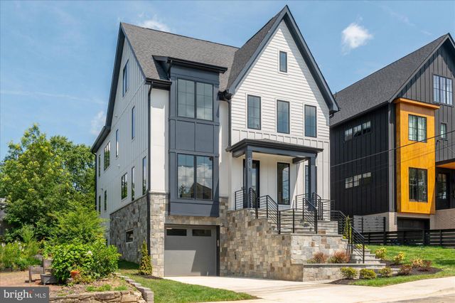 a view of a hallway view with wooden floor and staircase