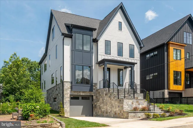 a view of a hallway view with wooden floor and staircase