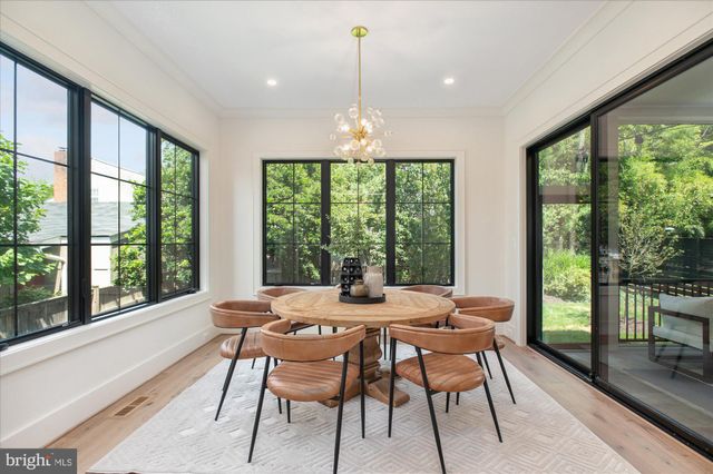 a bathroom with a sink vanity mirror and toilet