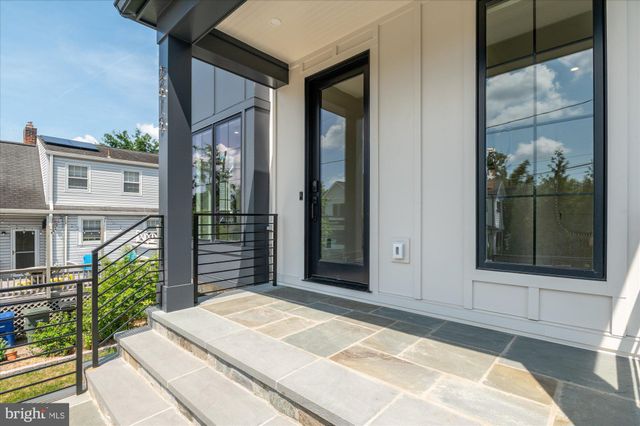 a view of a livingroom with furniture and hardwood floor