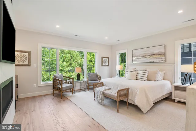 a room with a wooden floor and view of cabinet