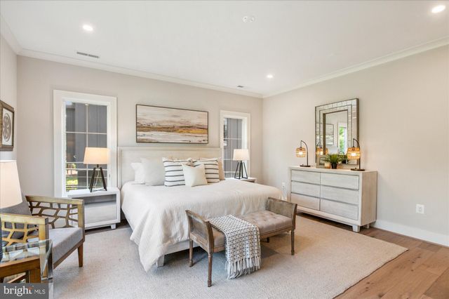 a bathroom with a granite countertop sink a mirror and a bathtub