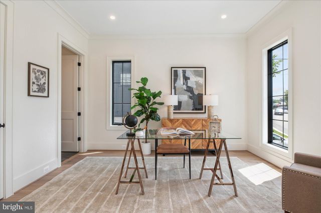 a view of a livingroom with furniture window and wooden floor