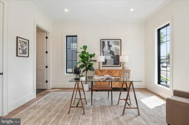 a view of a livingroom with furniture window and wooden floor