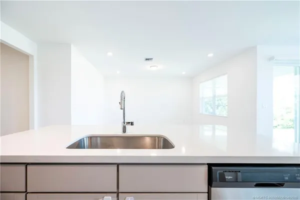 a kitchen with a sink and a window