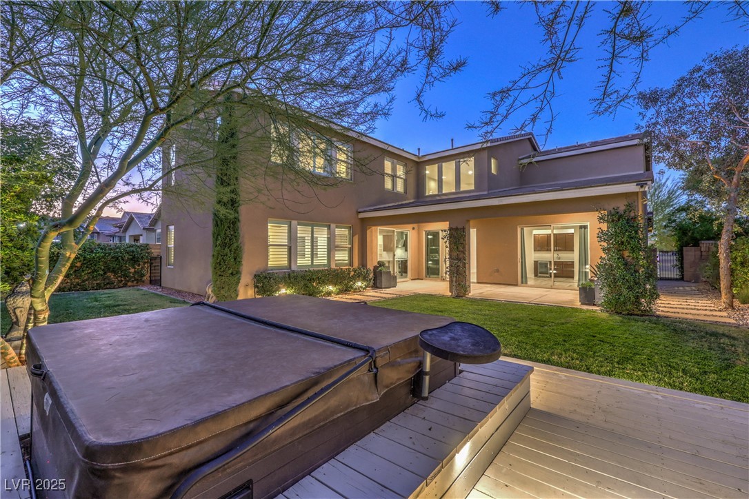 9655 Skye Star Avenue Las Vegas, NV 89166 - Photo 3 of 46 Rear view of property featuring a patio area, a deck, stucco siding, and a hot tub