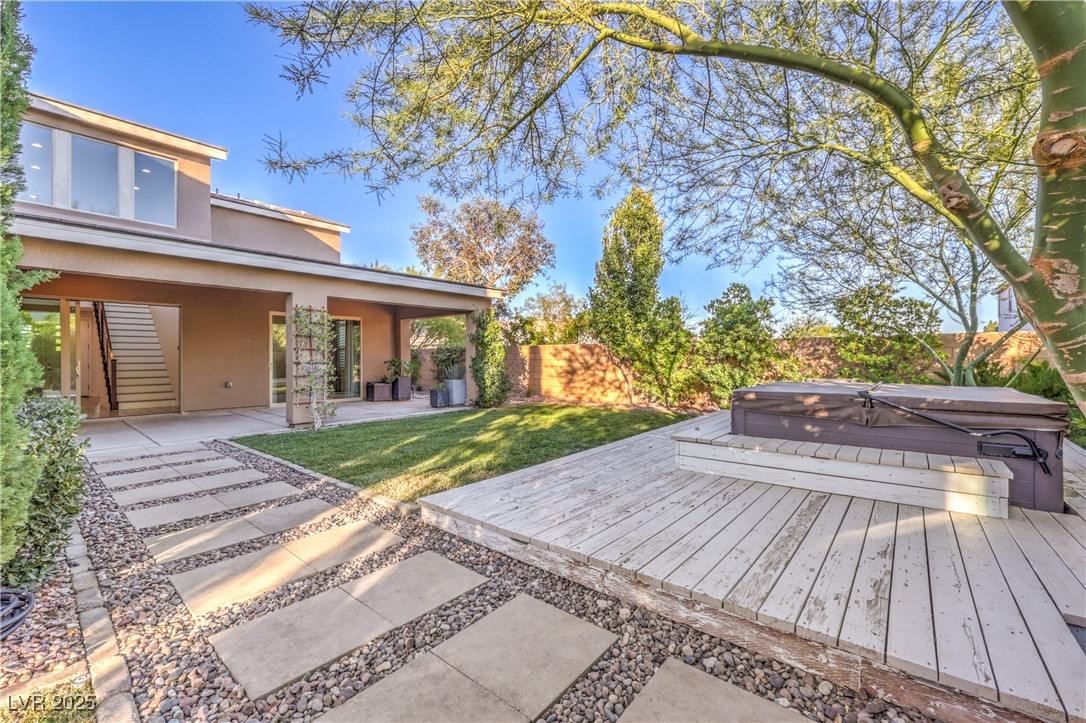 9655 Skye Star Avenue Las Vegas, NV 89166 - Photo 32 of 46 Fenced backyard with a covered hot tub, a patio area, and a deck