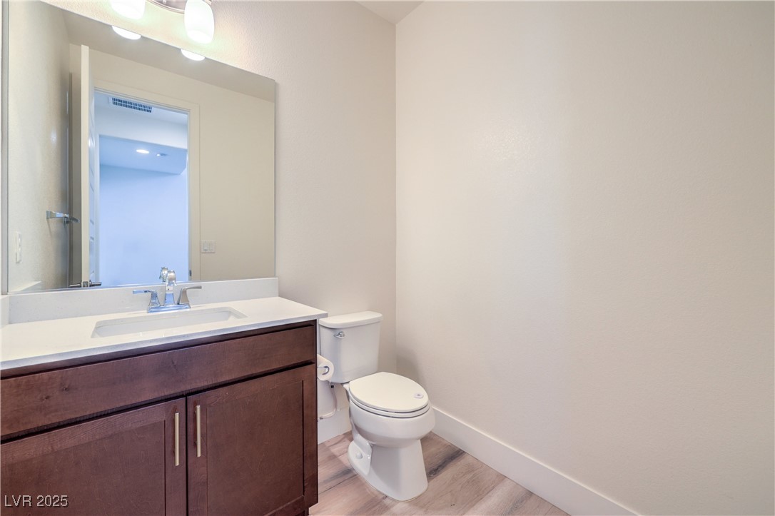 9655 Skye Star Avenue Las Vegas, NV 89166 - Photo 39 of 46 Bathroom featuring vanity and light wood-style floors
