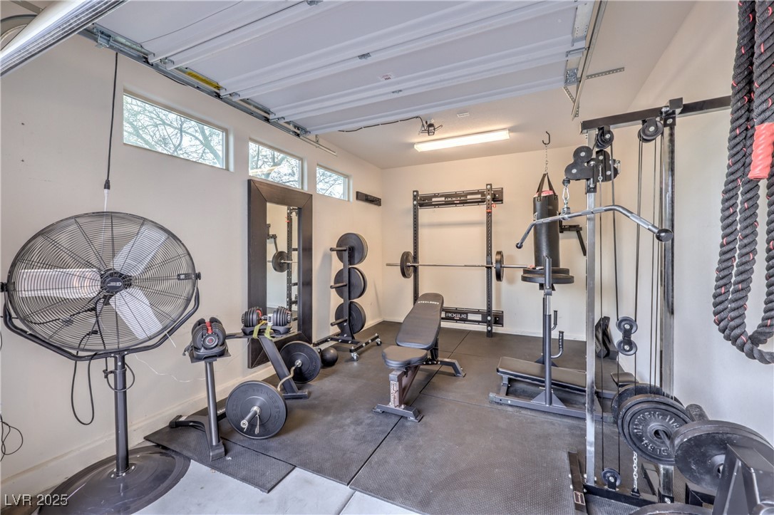 9655 Skye Star Avenue Las Vegas, NV 89166 - Photo 41 of 46 Workout room featuring rubber floors and baseboards