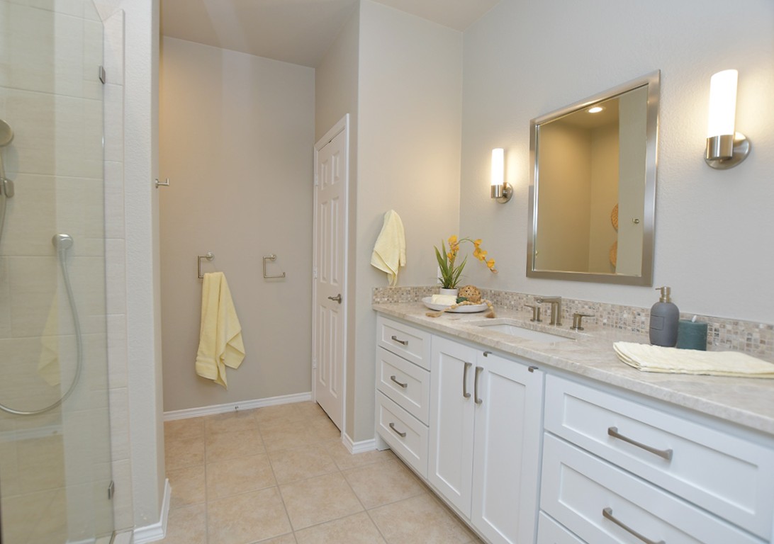 203 Winter Drive Georgetown, TX 78633 - Photo 17 of 29 Stylish mirrors and light fixtures were a part of the primary bath update.