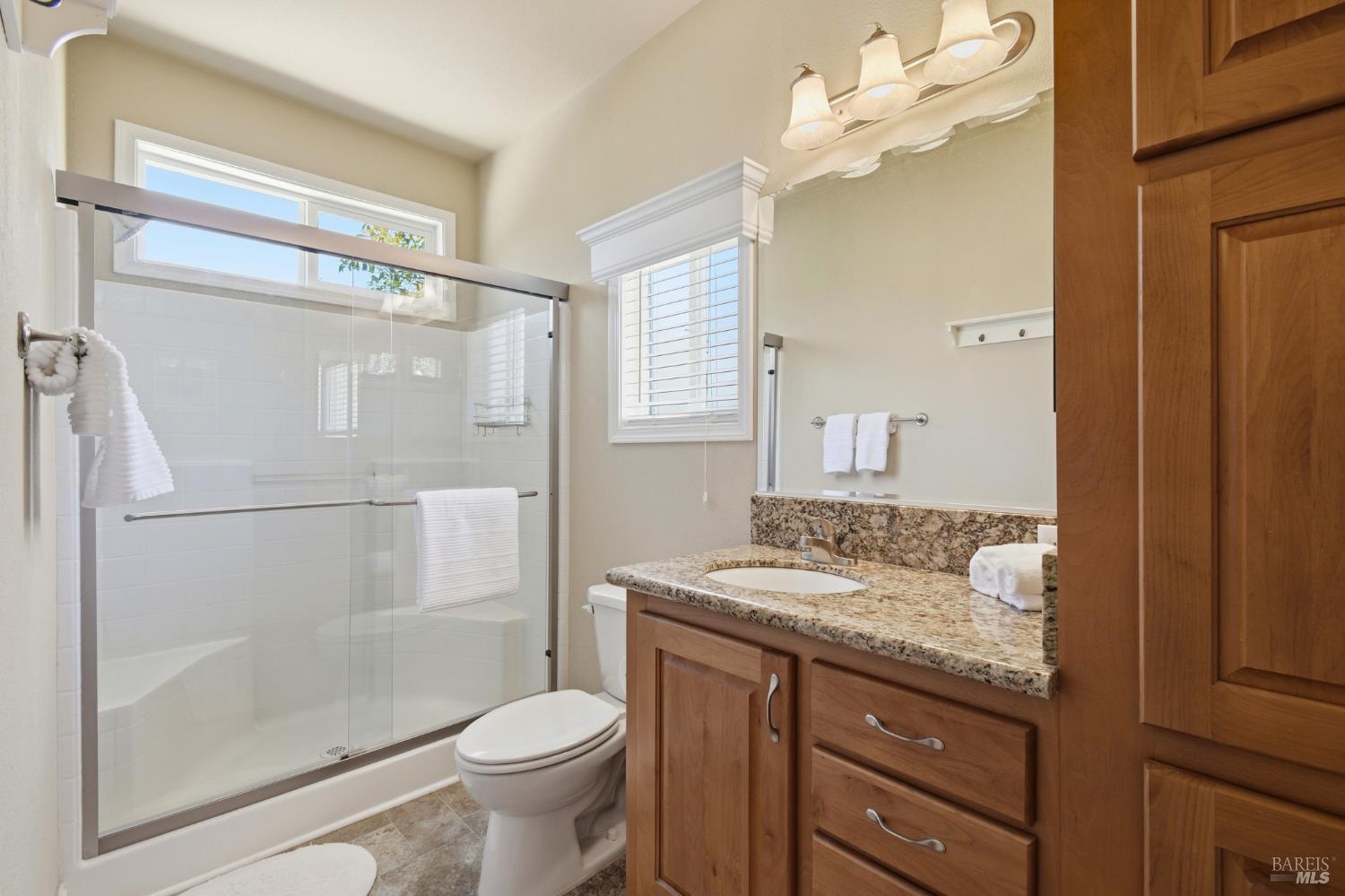 120 Shamrock Circle Santa Rosa, CA 95403 - Photo 26 of 45 a bathroom with a granite countertop sink toilet and shower