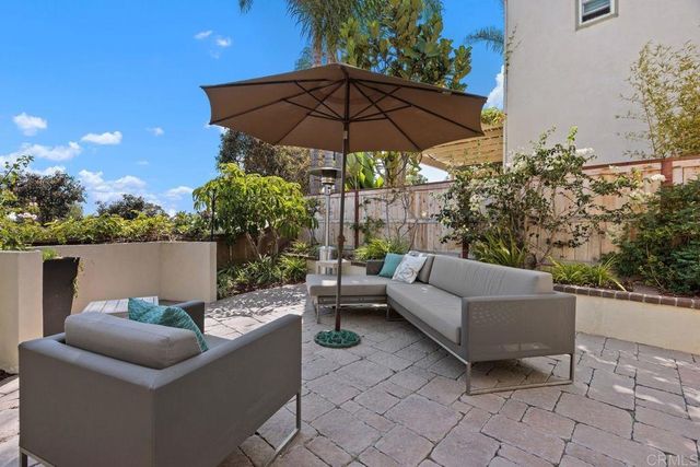 a view of a backyard with a patio