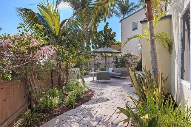 a bathroom with a sink toilet and window