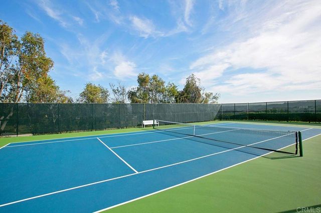 a view of a swimming pool with a yard