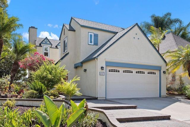 a view of a house with a tree
