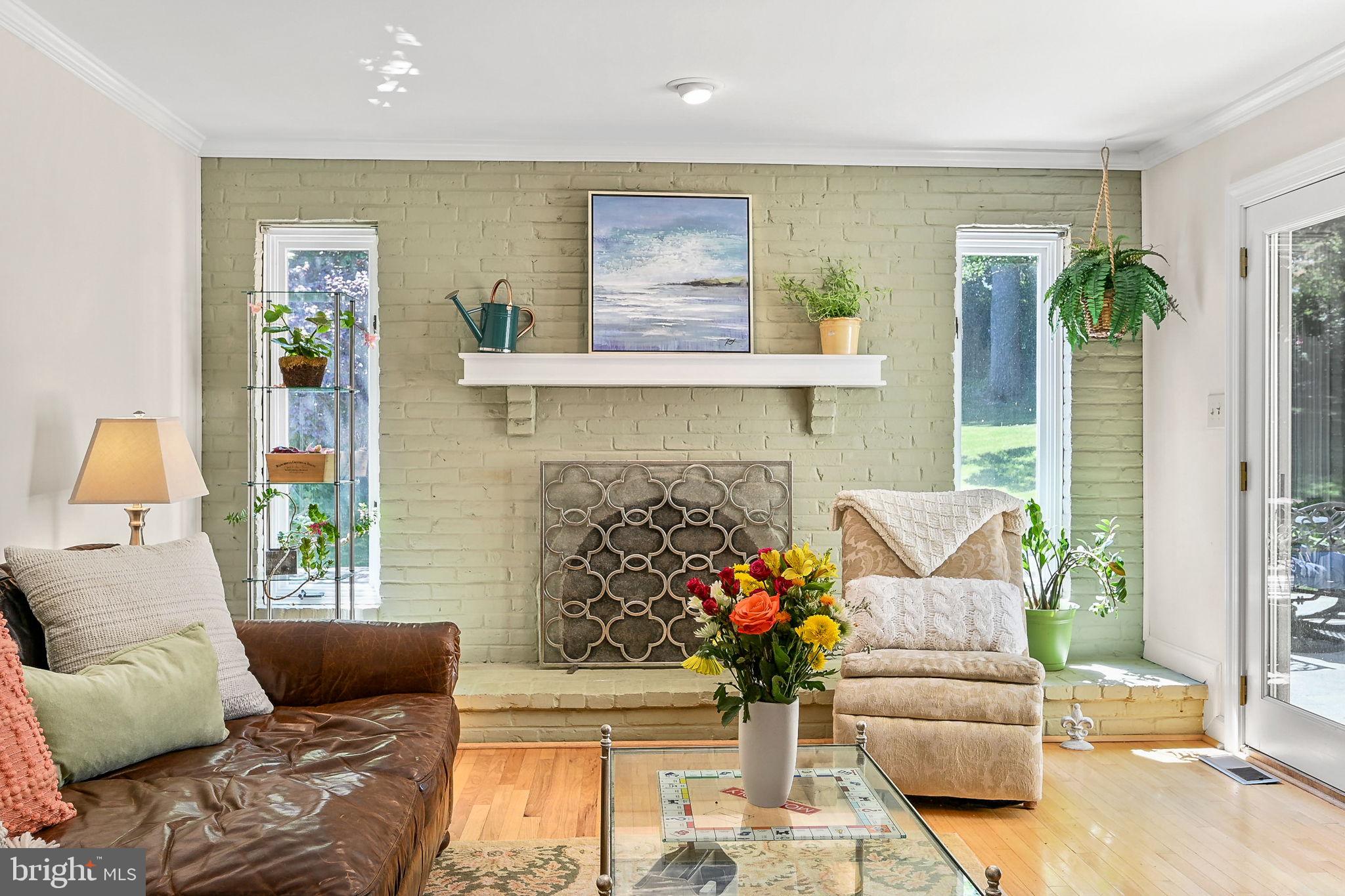 923 Copper Beech Lane Wayne, PA 19087 - Photo 11 of 45 Gas fireplace with brick surround