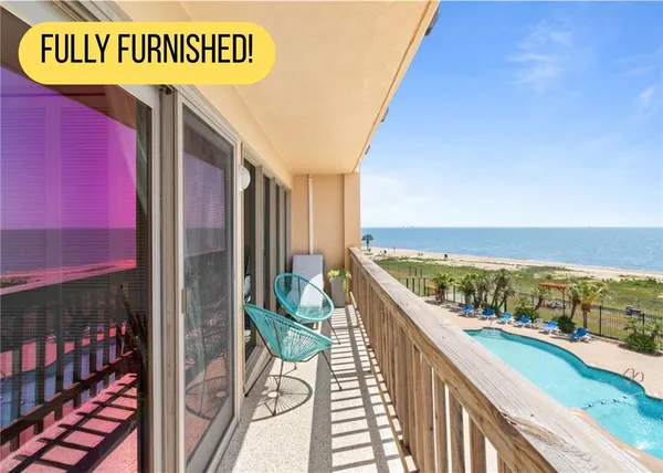 a view of balcony with furniture