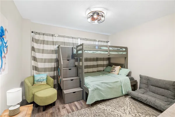 a bedroom with a bed and a couch