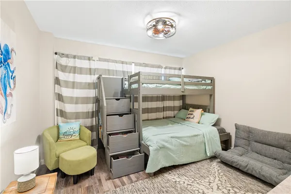 a bedroom with a bed and a couch