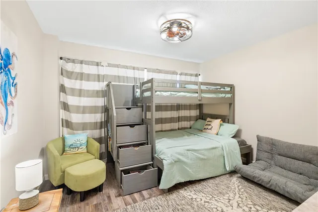 a bedroom with a bed and a couch