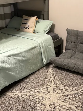 a bedroom with a bed and a couch