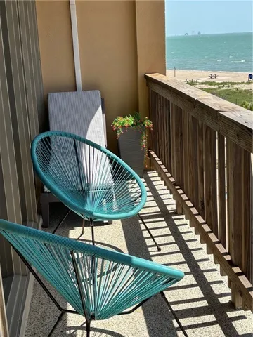 a view of a balcony with furniture