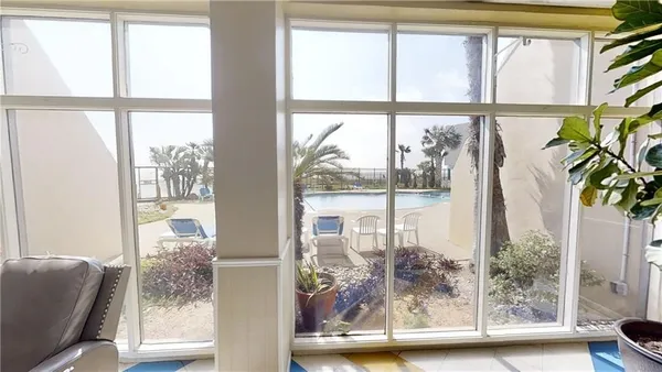 kids room with large windows and wooden floor