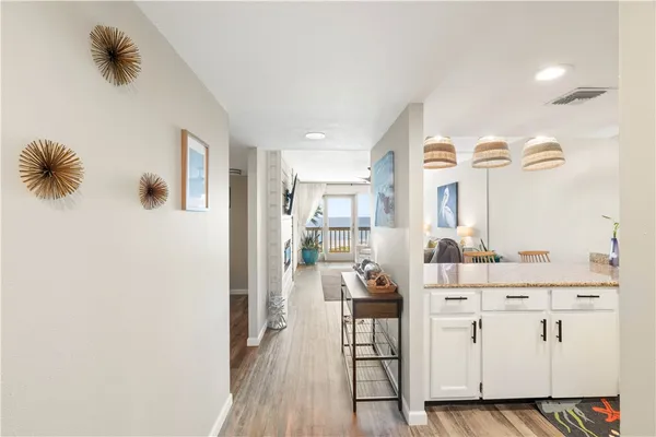 a view of kitchen with furniture and wooden floor