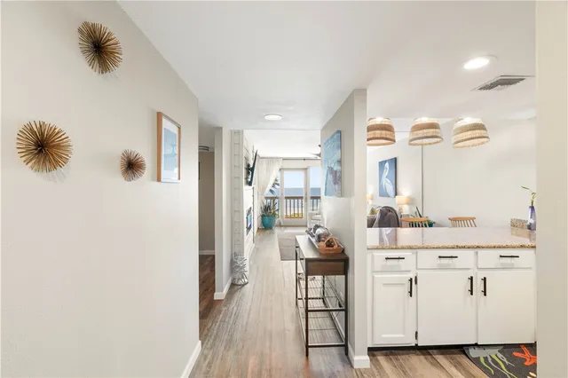 a view of kitchen with furniture and wooden floor