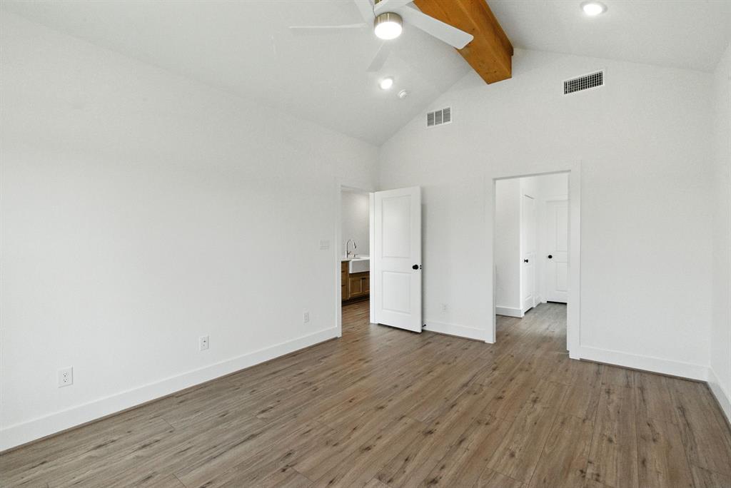 421 Jameson Springtown, TX 76082 - Photo 15 of 37 an empty room with wooden floor and windows