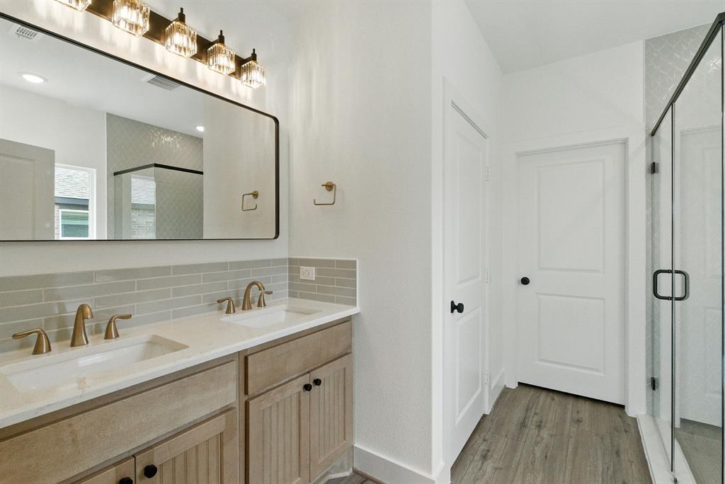 421 Jameson Springtown, TX 76082 - Photo 16 of 37 a bathroom with a double vanity sink mirror and