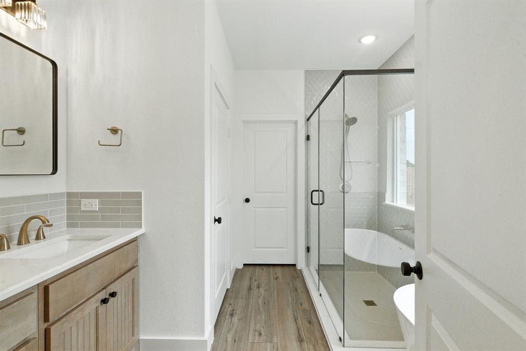 421 Jameson Springtown, TX 76082 - Photo 17 of 37 a bathroom with a sink a toilet and shower