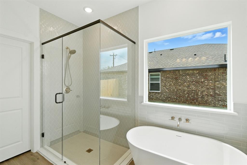 421 Jameson Springtown, TX 76082 - Photo 18 of 37 a bathroom with a shower sink and mirror