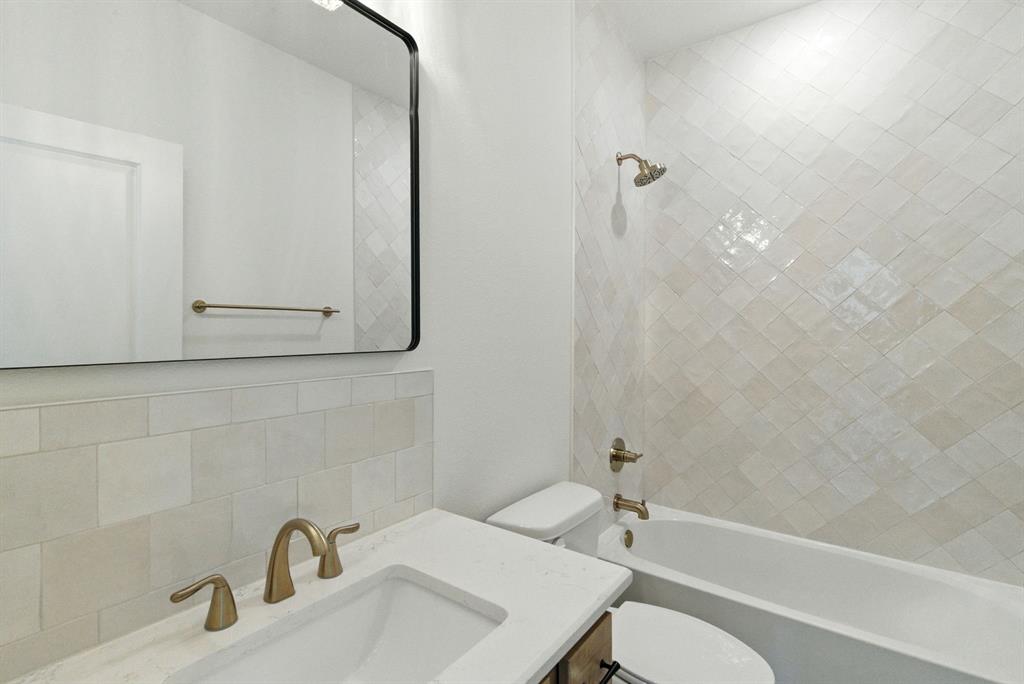 421 Jameson Springtown, TX 76082 - Photo 24 of 37 a bathroom with a sink a toilet and shower