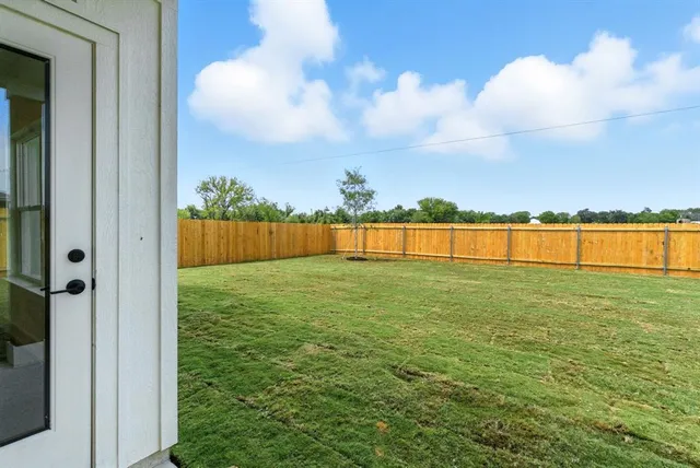 a view of outdoor space with deck and yard