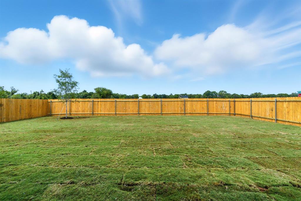 421 Jameson Springtown, TX 76082 - Photo 32 of 37 a view of outdoor space with deck and yard