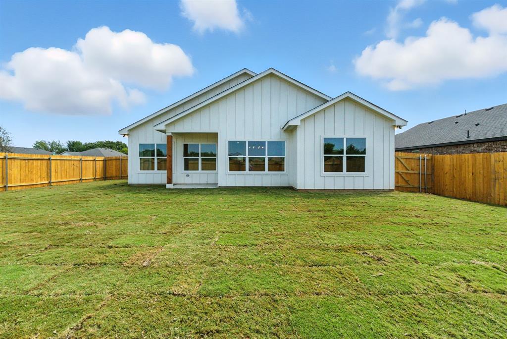 421 Jameson Springtown, TX 76082 - Photo 34 of 37 a view of a house with a backyard